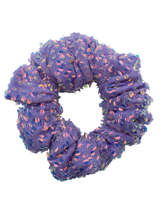 Purple scrunchie with multicolored pattern on a light gray background
