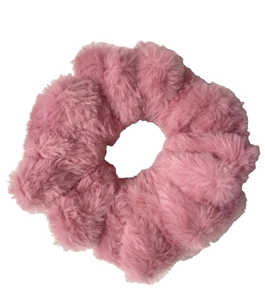 Pink fluffy scrunchie on a white background